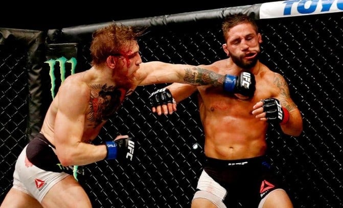Conor McGregor knocks out Chad Mendes at UFC 189