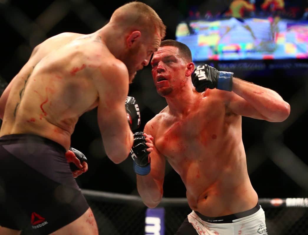 Nate Diaz throws a straight left hand during his UFC 196 submission victory over Conor McGregor