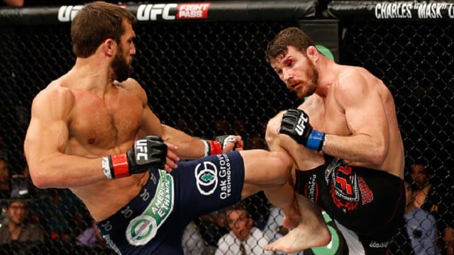 SYDNEY, AUSTRALIA - NOVEMBER 08:  (L-R) Luke Rockhold of the United States kicks Michael Bisping of England in their middleweight bout during the UFC Fight Night event inside Allphones Arena on November 8, 2014 in Sydney, Australia.  (Photo by Josh Hedges/Zuffa LLC/Zuffa LLC via Getty Images)