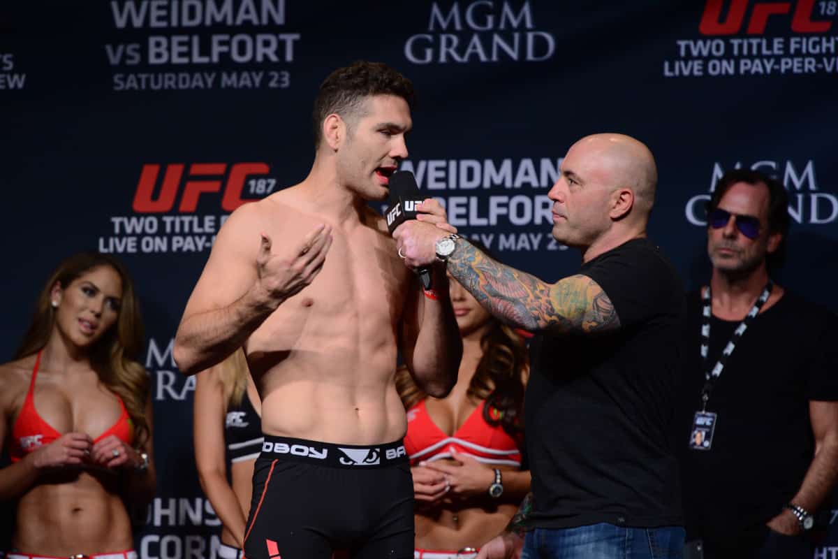 May 22, 2015; Las Vegas, NV, USA; Chris Weidman (L) speaks with commentator Joe Rogan (R) after weighing in for his middleweight championship bout against Vitor Belfort (not pictured) at MGM Grand Ballroom. Mandatory Credit: Joe Camporeale-USA TODAY Sports