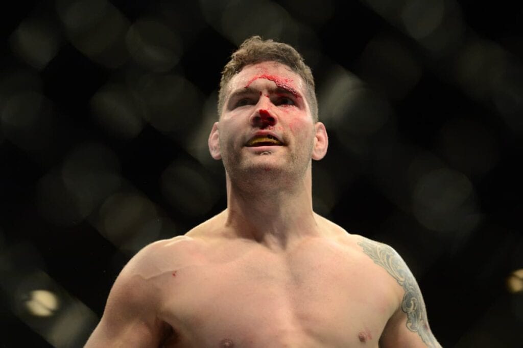 May 23, 2015; Las Vegas, NV, USA; Chris Wiedman (red gloves) celebrates after knocking out Vitor Belfort (not pictured) during their middleweight championship bout during UFC 187 at MGM Grand Garden Arena. Weidman won via first round TKO. Mandatory Credit: Joe Camporeale-USA TODAY Sports