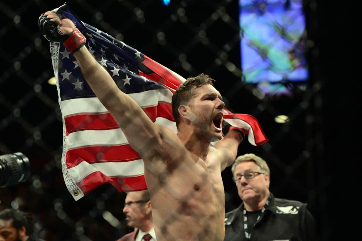 May 23, 2015; Las Vegas, NV, USA; Chris Wiedman (red gloves) celebrates after knocking out Vitor Belfort (not pictured) during their middleweight championship bout during UFC 187 at MGM Grand Garden Arena. Weidman won via first round TKO. Mandatory Credit: Joe Camporeale-USA TODAY Sports