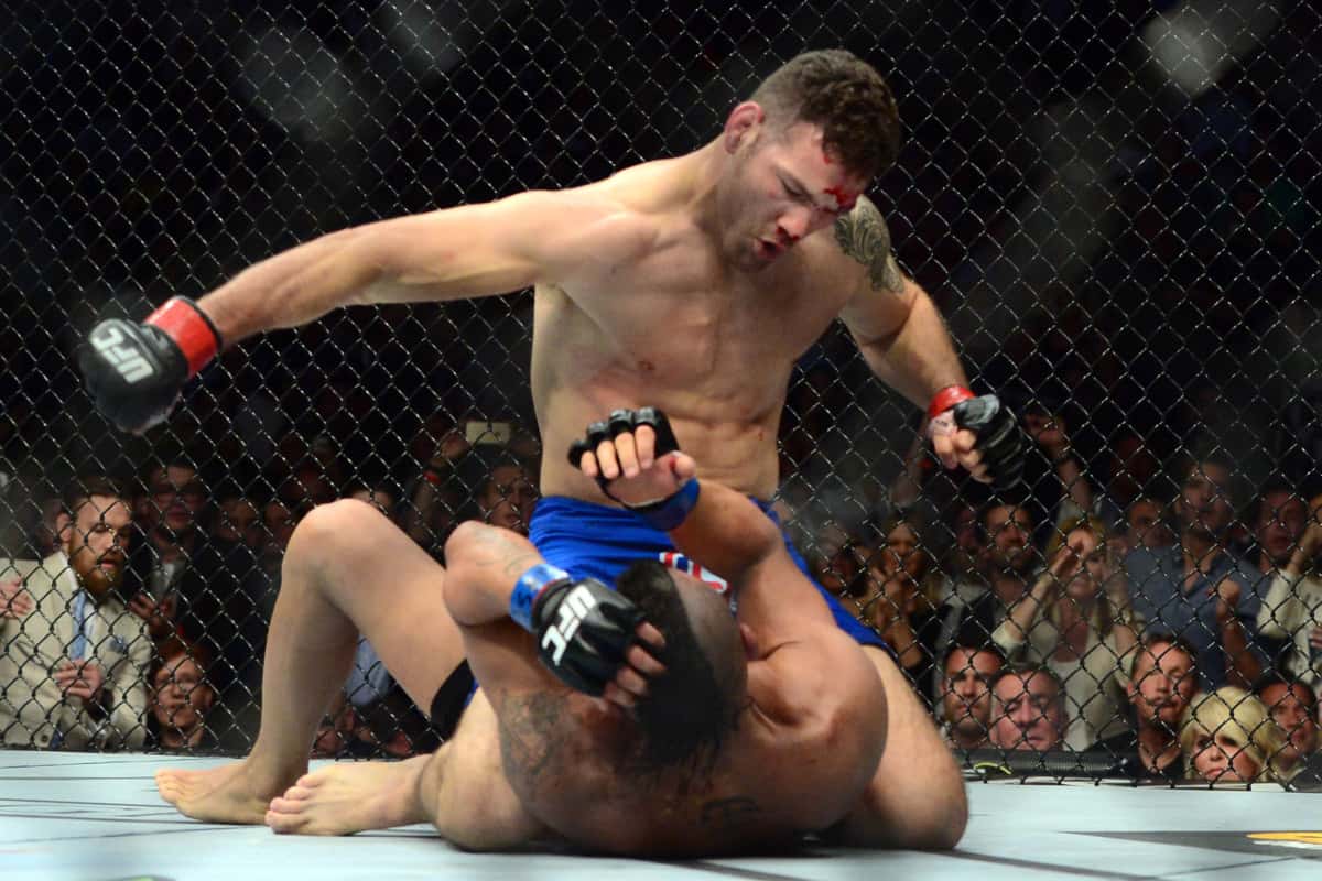 May 23, 2015; Las Vegas, NV, USA; Chris Wiedman (red gloves) and Vitor Belfort (blue gloves) fight during their middleweight championship bout during UFC 187 at MGM Grand Garden Arena. Weidman won via first round TKO. Mandatory Credit: Joe Camporeale-USA TODAY Sports