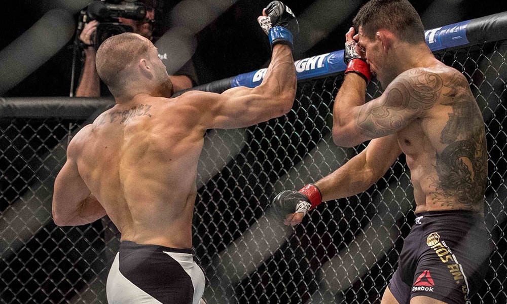 Jul 7, 2016; Las Vegas, NV, USA; Eddie Alvarez lands a hit against Rafael Dos Anjos during UFC Fight Night at MGM Grand Graden Arena. Mandatory Credit: Joshua Dahl-USA TODAY Sports