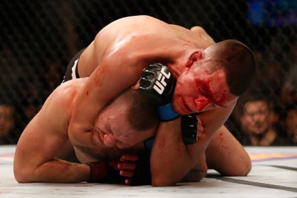Nate Diaz chokes Conor McGregor for the tap at UFC 196...