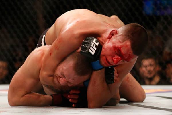 Nate Diaz chokes Conor McGregor for the tap at UFC 196...