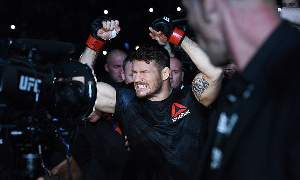 Oct 8, 2016; Manchester, UK; Michael Bisping (red gloves) enters the arena before his fight against Dan Henderson (blue gloves) during UFC 204 at Manchester Arena. Mandatory Credit: Per Haljestam-USA TODAY Sports