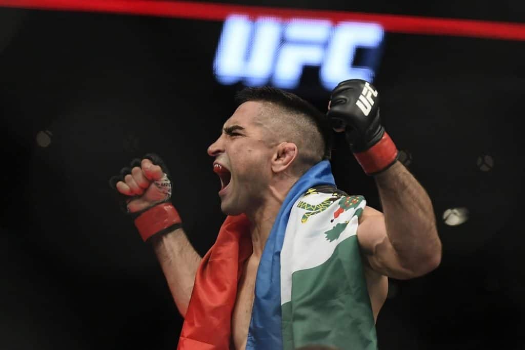 Nov 5, 2016; Mexico City, Mexico; Ricardo Lamas (red gloves) defeats Charles Oliveira (blue gloves) during UFC Fight Night at Distrito Federal. Mandatory Credit: Etzel Espinosa-USA TODAY Sports 