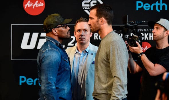 Video: Luke Rockhold & Yoel Romero Nearly Throw Down At UFC 221 Weigh-Ins