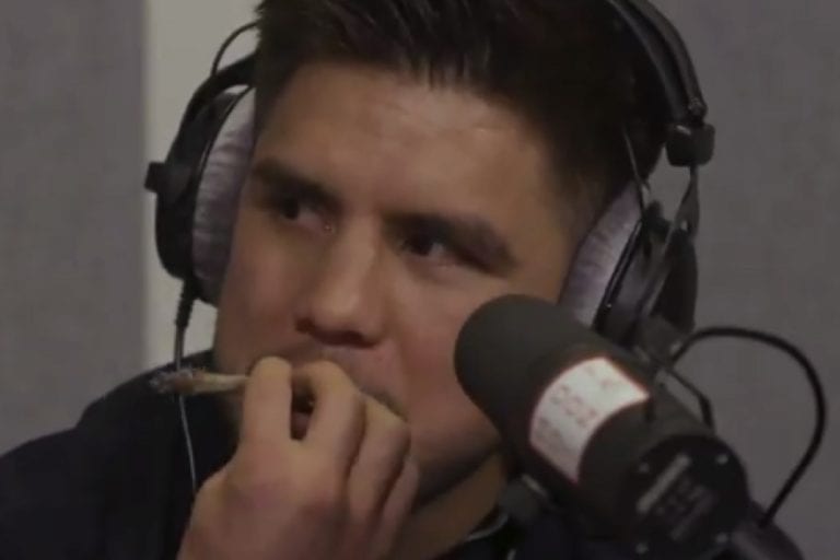 Video: Henry Cejudo Smokes Joint On Air With Mike Tyson