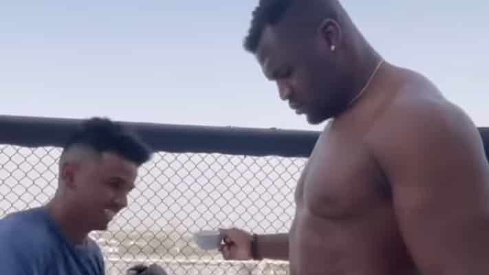 Francis Ngannou Challenges Man to Punch Him While He Sips Coffee