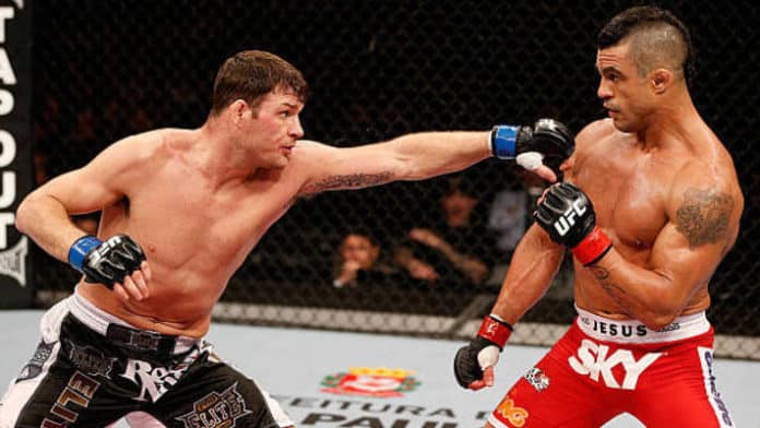 Michael Bisping Hopes Evander Holyfield ‘Beats The F*ck’ Out Of ‘Piece Of Sh*t’ Vitor Belfort