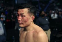 The Korean Zombie retrieves glove following retirement fight Max Holloway UFC Singapore