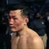 The Korean Zombie retrieves glove following retirement fight Max Holloway UFC Singapore