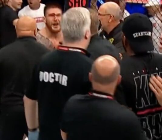 Leon Edwards held back by security after Johnny Eblen KO's his brother at Bellator 299