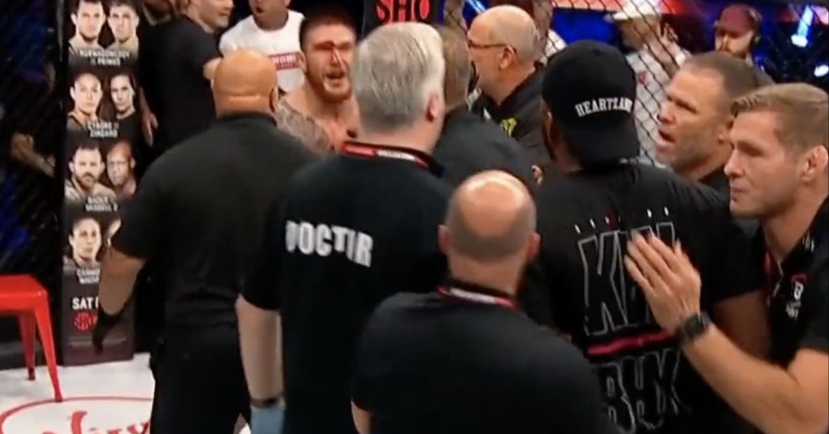 Leon Edwards held back by security after Johnny Eblen KO's his brother at Bellator 299