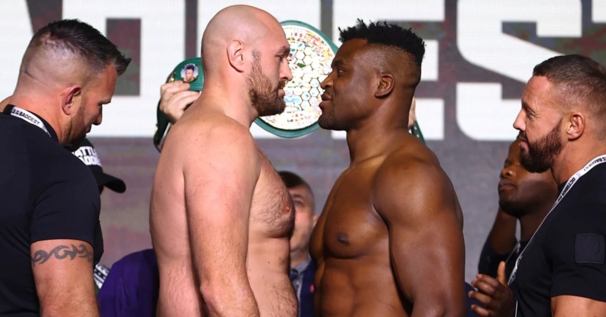 Tyson Fury clashes heads with Francis Ngannou leans on him during tense face-off weigh-ins