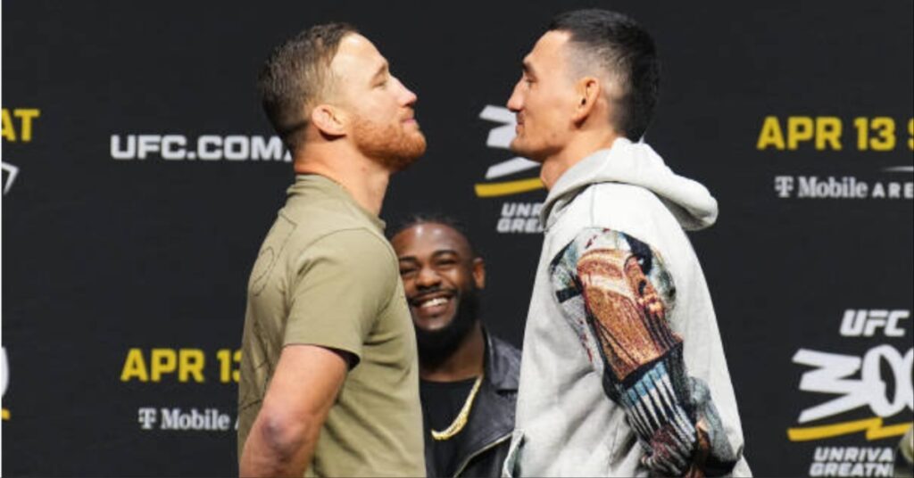 Max Holloway tries to pants Justin Gaethje during face off ahead of UFC 300 title fight