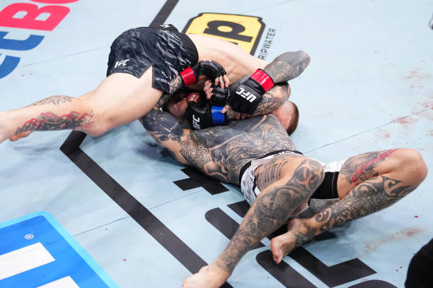 Chris Duncan Submits Jordan Vucenic with Slick Second-Round Guillotine Choke - UFC London Highlights 3 gettyimages 2206414737 612x612 1