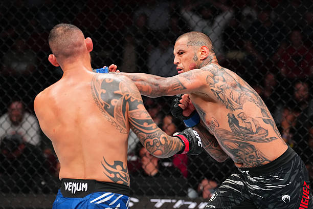 Daniel Rodriguez Sleeps Santiago Ponzinibbio with Vicious Left Hand - UFC Des Moines Highlights 5 gettyimages 2213281636 612x612 1