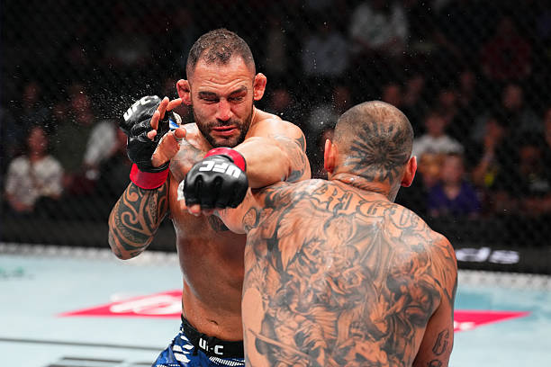Daniel Rodriguez Sleeps Santiago Ponzinibbio with Vicious Left Hand - UFC Des Moines Highlights 3 gettyimages 2213281637 612x612 1