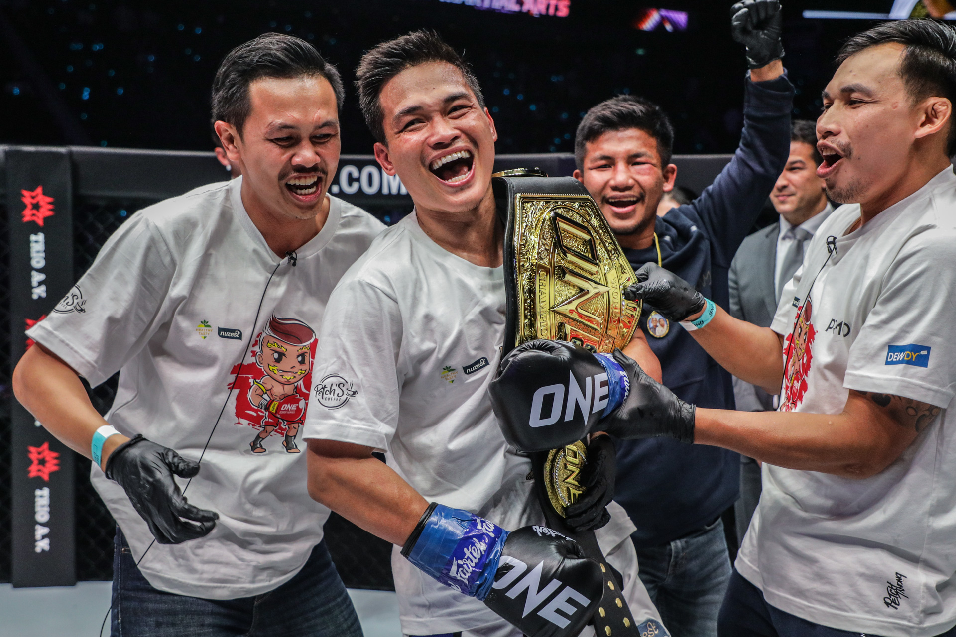 Petchanong with ONE Championship beltRodtang in background
