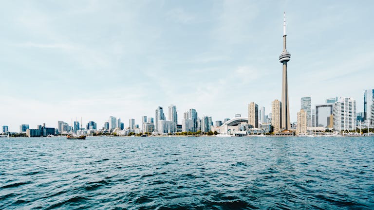 Beautiful daytime view of Toronto's skyline with CN Tower and waterfront.