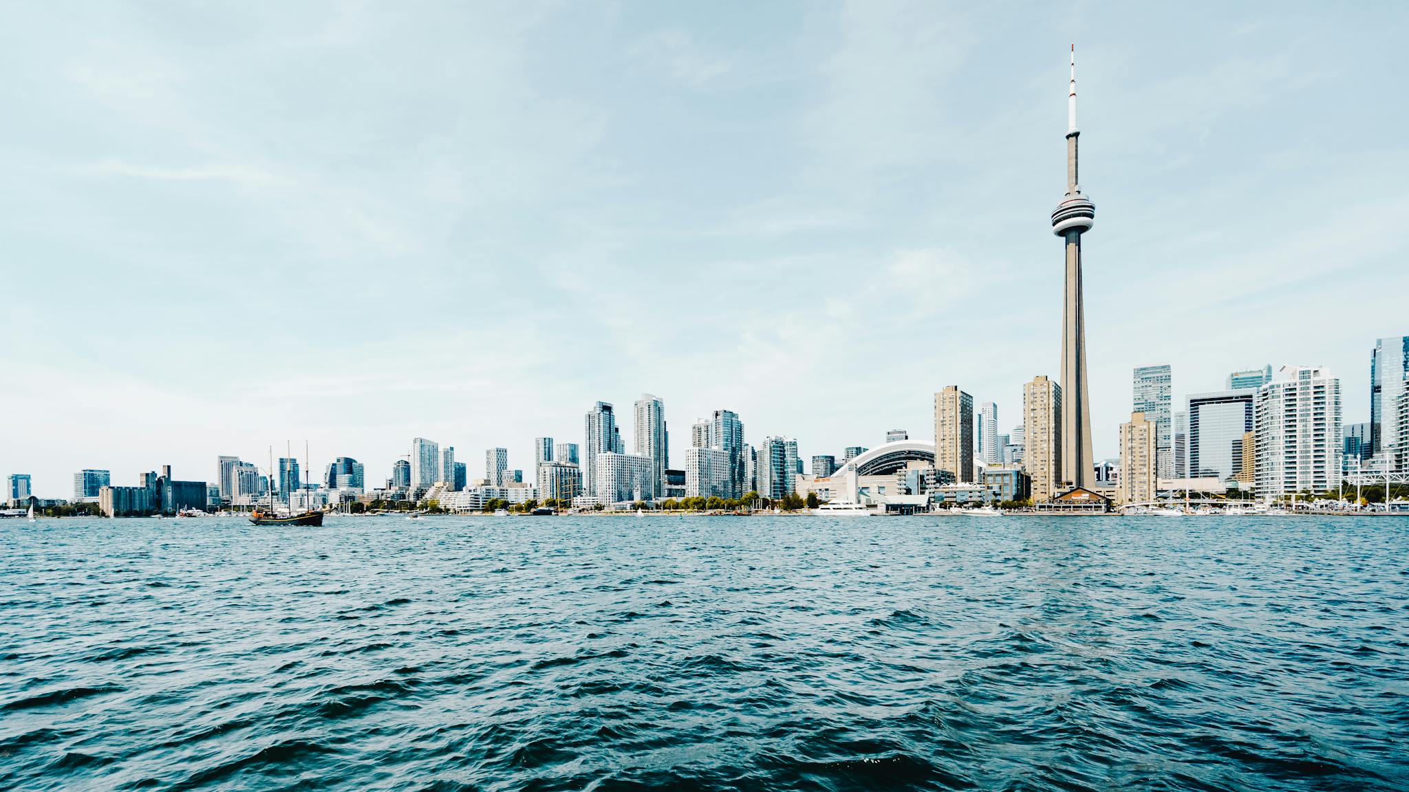 Beautiful daytime view of Toronto's skyline with CN Tower and waterfront.